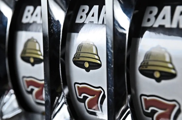 Baccarat dealt cards and betting chips on live M-World Championship table
